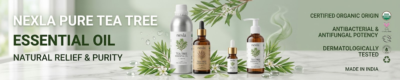 tea tree leaves with essential oil bottle